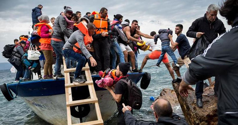 Migrants getting off a boat